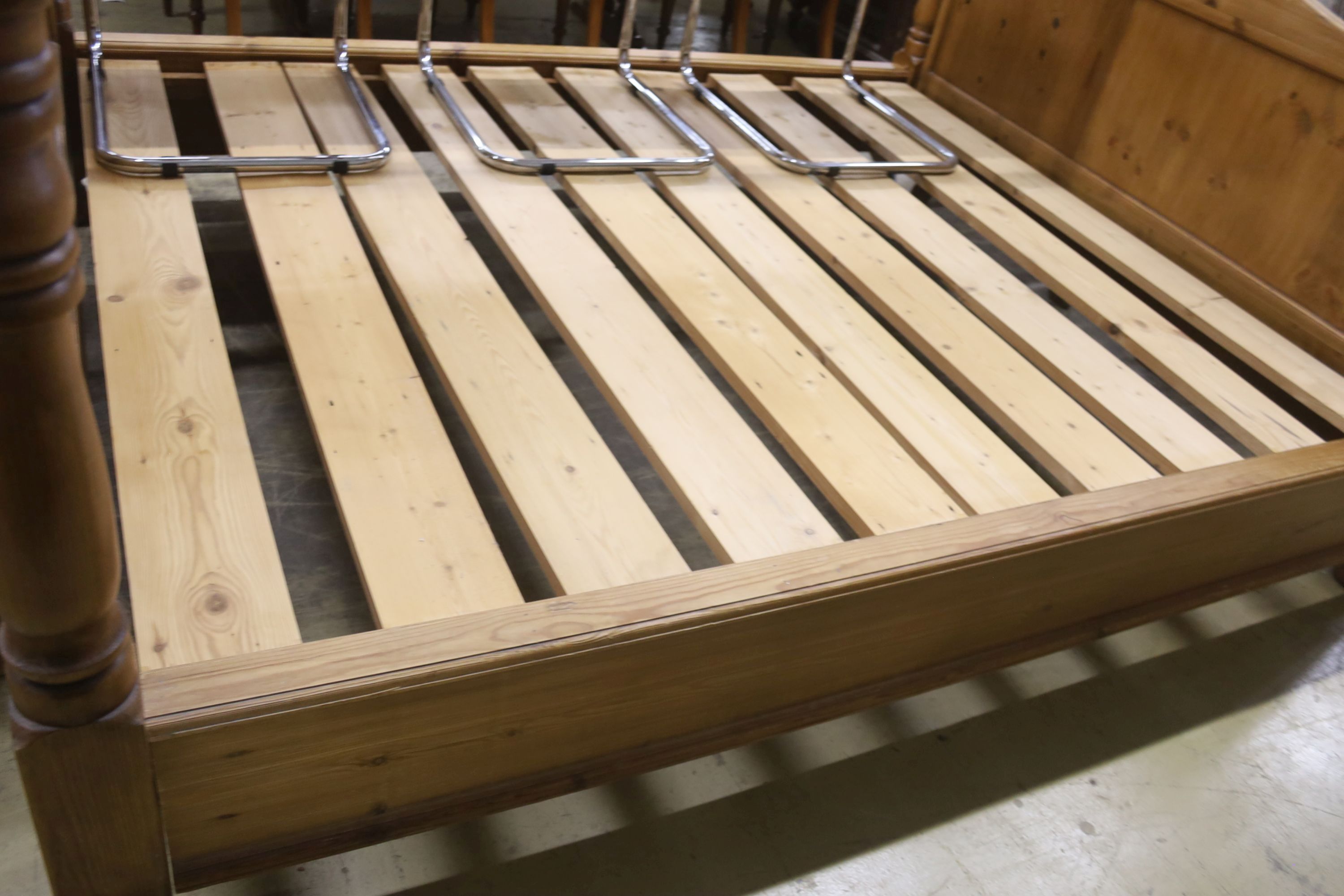 A king size pine bed frame with side rails and slats, width 170cm, length 213cm